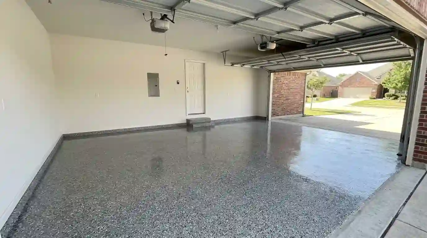 Freshly coated epoxy flake garage floor in a Fort Worth home