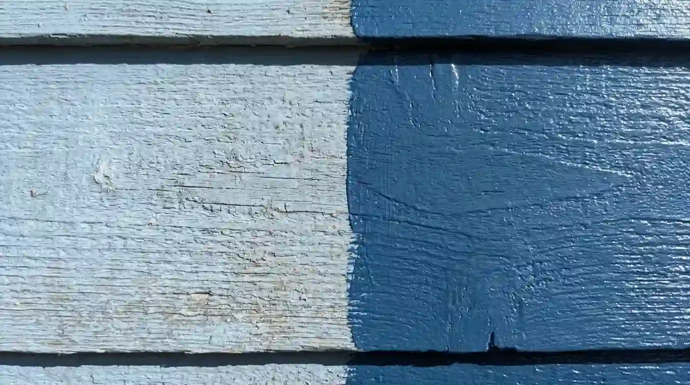 Faded chalky siding next to a fresh acrylic coat